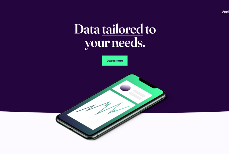 The hero section of a website with the words data tailored to your needs and an image of a smartphone